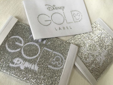 L'abbigliamento tessuto popolare dell'estremità di Bage dell'oro di Disney identifica il taglio freddo/taglio del calore