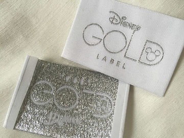 L'abbigliamento tessuto popolare dell'estremità di Bage dell'oro di Disney identifica il taglio freddo/taglio del calore
