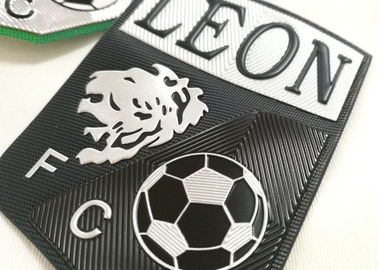 L'abbigliamento di gomma sollevato su ordine del trasferimento di calore identifica il logo della gomma di silicone
