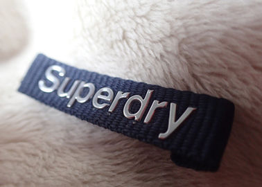 Etichetta d'argento ad alta frequenza del collo dell'abbigliamento di logo di Superdry 3D per i rivestimenti