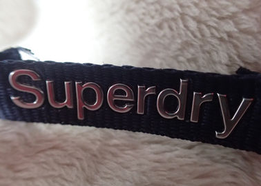 Etichetta d'argento ad alta frequenza del collo dell'abbigliamento di logo di Superdry 3D per i rivestimenti