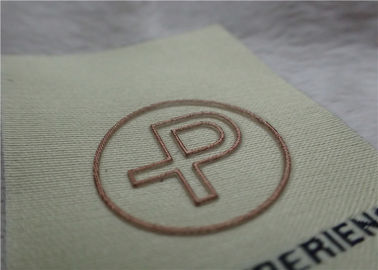 Le etichette dell'abbigliamento tessute metà di popolare di logo Shinny lo SGS BV di spessore OEKO dell'oro 0.4mm