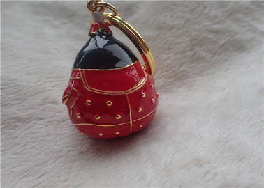 Catena chiave del bambino di stile cinese del lingotto grasso ceramico dell'oro in cappotto rosso